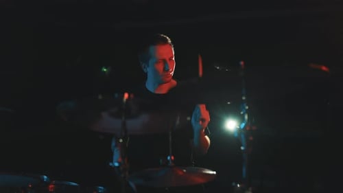 Rock Drummer Playing Drums During a Live Concert