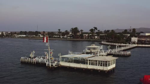 Peaceful Coastline Pier at Twilight Aerial View