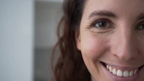Woman Smiling Close Up Portrait in Bright Light