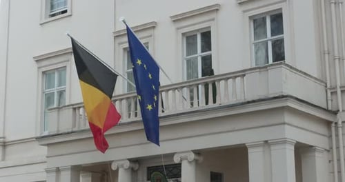 Belgian and European Flags Fly on Building