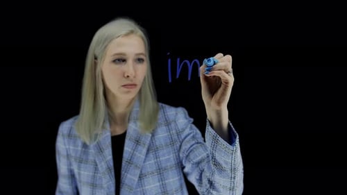 Import The Word Import is Written on a Dark Background By a Young Girl