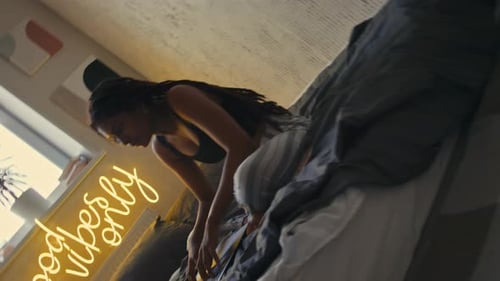 Woman Types On Laptop in Bedroom