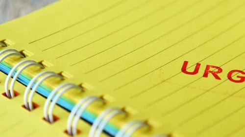 Red URGENT Word Stamp on a White Paper