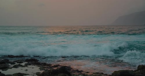 Soft Sunset Light Reflected on the Surface of the Ocean Water