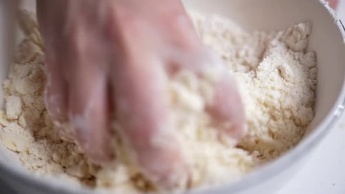 Hand Mixing Dough in Bowl for Baking
