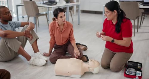 Cpr, teaching and mannequin with woman and workshop for first aid, learning or training