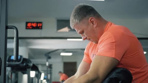 Strong Bodybuilder Man Training Pumping Up Biceps Muscles