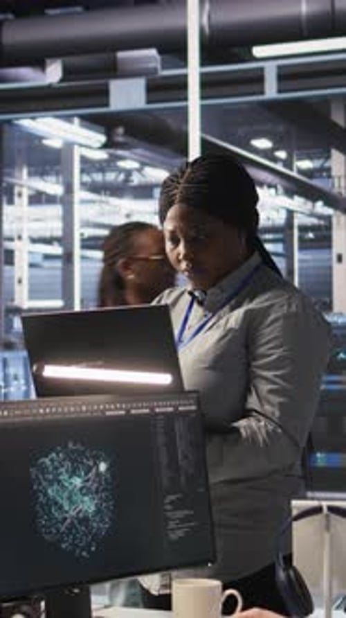 Vertical Video Portrait of Happy Technician Next to Data Center Colleagues Review AI Systems