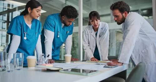 Meeting, paperwork and doctors in hospital with planning for diagnosis, surgery or treatment