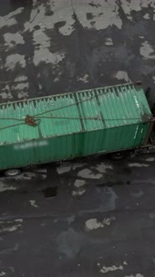 Vertical of The Car Wagon Truck Bringing a Container for Unloading in the Warehouse