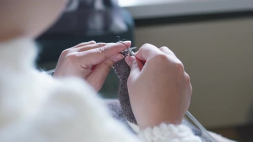 Hands Knitting Gray Wool Fabric Close Up