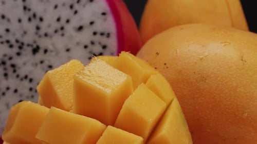A Mango and a Costa Rican Pitahaya are on the Cutting Board