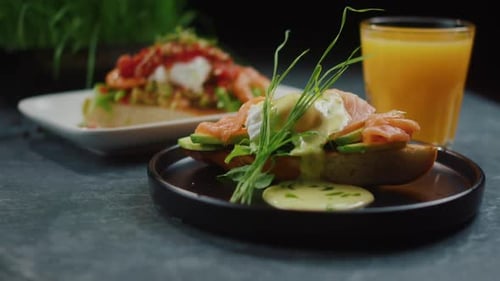 Bruschetta with Salmon and Avocado on a Black Plate Restaurant Dish