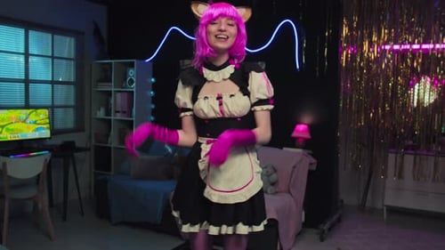 Young Woman Dancing in Cosplay Costume With Pink Hair