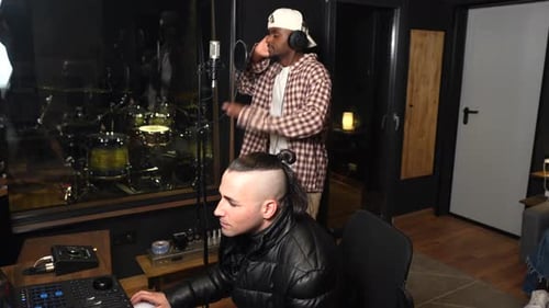 Musicians recording music in studio