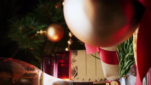 Lit Christmas candle and gifts