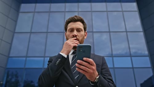 Businessman Worried Cellphone Message Standing Urban Business Area Closeup