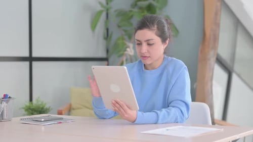 Woman Reacting to Content on Tablet Device
