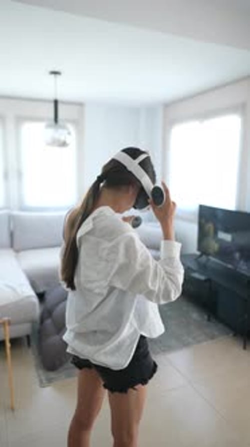 Young Adult Using Virtual Reality Headset in Home