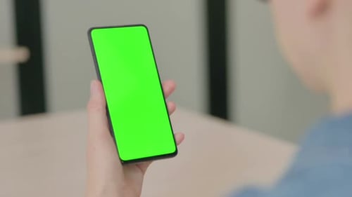 Close Up of Young Woman Using Smartphone with Green Screen