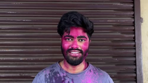 Smiling Man Covered in Holi Color Powder