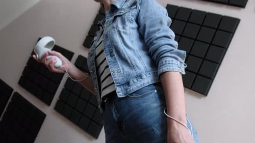 Woman Enjoys Virtual Reality in Acoustic Panel Room