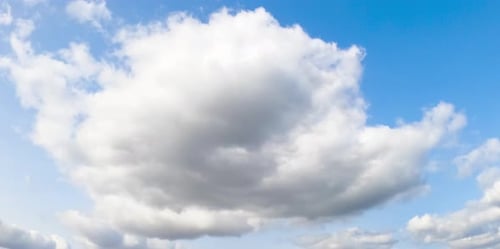 Light clouds on blue bright sky. Summer sky motion of cloudscapes.