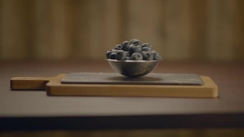 Fresh Blueberries in Bowl on Cutting Board