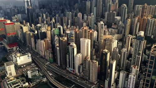 Drone, skyline and urban for development with motorway for transport in city for commuting in Hong