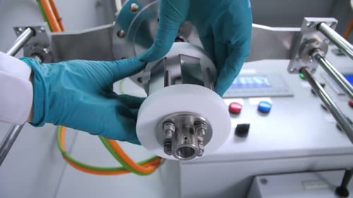 Worker Removes Part of Machine Tool in Chemical Laboratory
