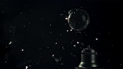Lightbulb Shattering in Slow Motion on Black Background