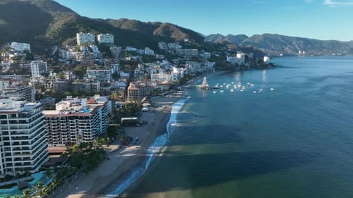Playa De Los Muertos beach and pier close to famous Puerto Vallarta Malecon, the city largest public