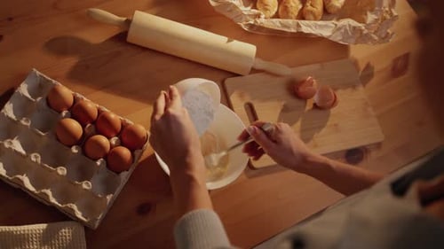 Preparing Dough with Eggs and Flour at Home