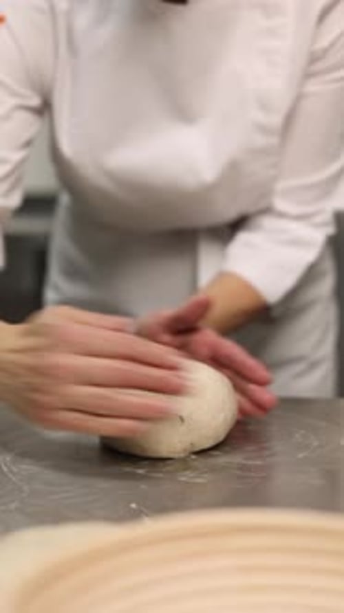 a chef makes bread in a bakery