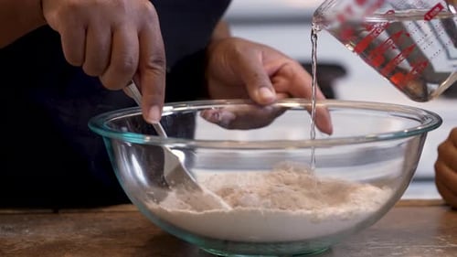 Mixing Flour and Water in Glass Bowl