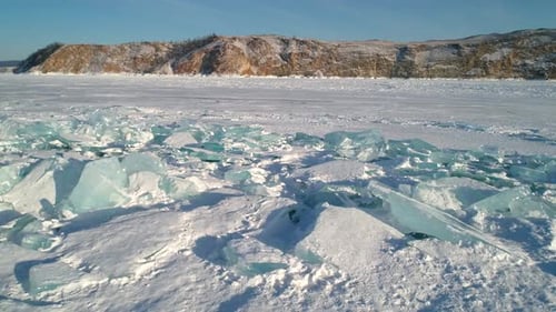 Aerial Over Crystal Clear Floes Hummocks and Blocks of Broken Unique Ice Lake Baikal Popular Tourist