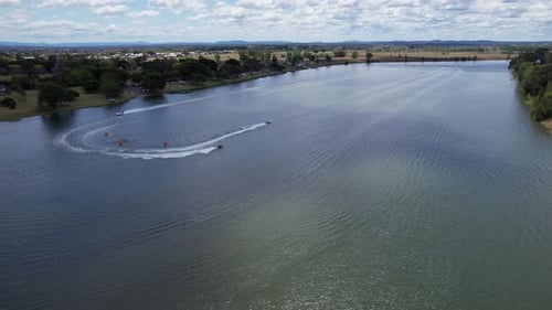 Aerial View Of Motorboats Speeding And Leaving Wake On Clarence River. Boat Racing Event In Grafton,