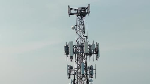 Television or Radio Telephone Tower in a Cityscape at Day Time Zoom Aerial Drone Shot