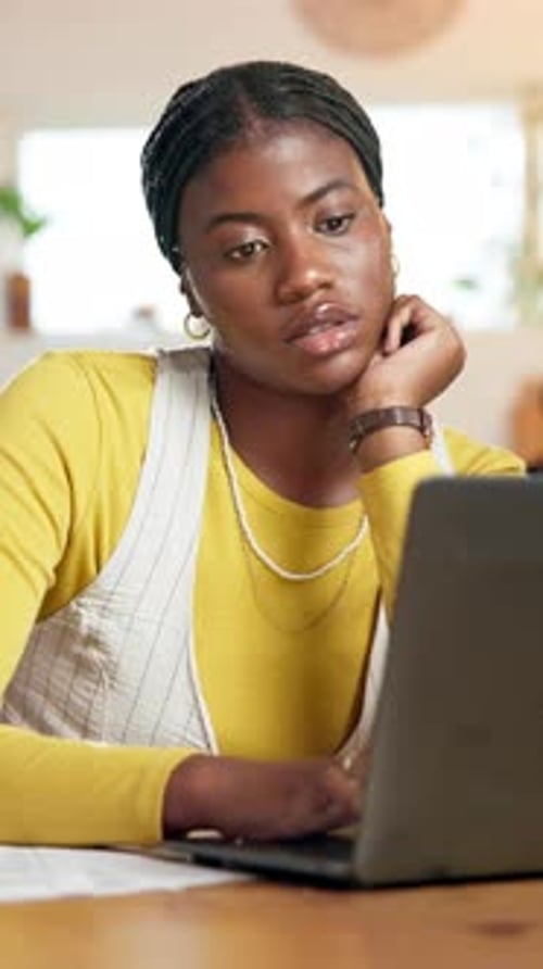 Woman Works On Laptop At Home