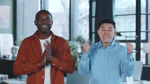 Two Men Standing in Office