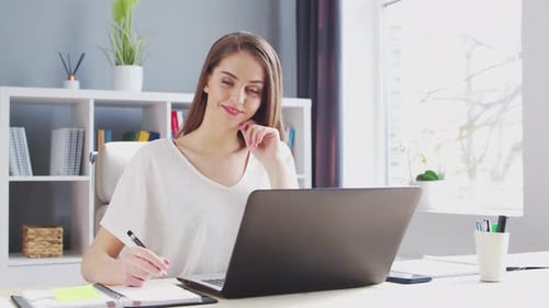 Young Woman Works at Home Office Using Computer Workplace of Female Entrepreneur Freelancer or