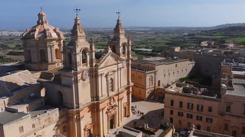 Aerial Pan of Mdina and St Pauls Cathedral in Late Afternoon Light
