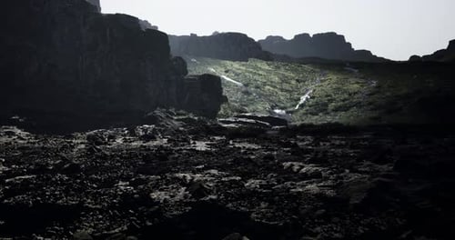 Mountains and Rocky Terrain Illuminated By Soft Sunlight at Dawn