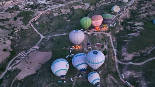 Hot Air Balloons Fly Over the Mountainous Landscape of Cappadocia Turkey
