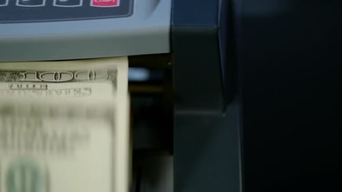 Counting Us Dollars Banknotes on Currency Counter Machine. Bank Automatic Equipment For