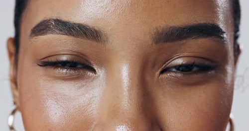 Eyebrows, face or model in studio with closeup, glow or smile for shine