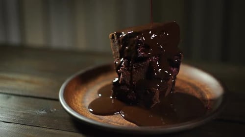 Delicious chocolate brownies with chocolate sauce drizzled on top