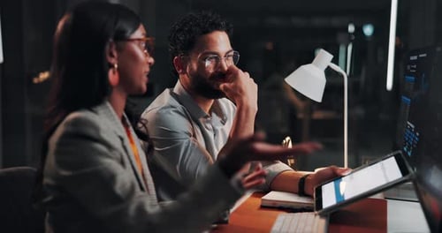 Investment, night and people with computer, conversation and teamwork with portfolio management