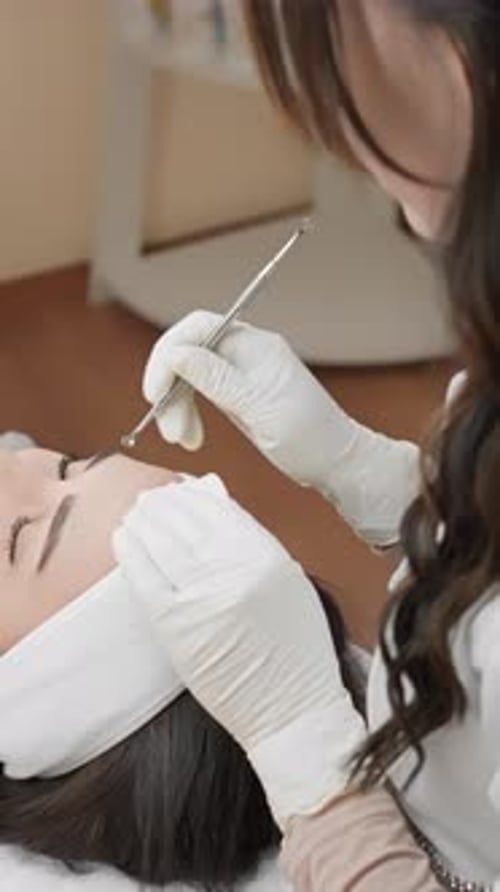 Woman Receives Facial Beauty Treatment at Spa