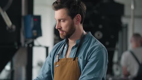 Caucasian Man Working in Factory Roasting Coffee Beans Roaster Machine Industrial Production Aroma